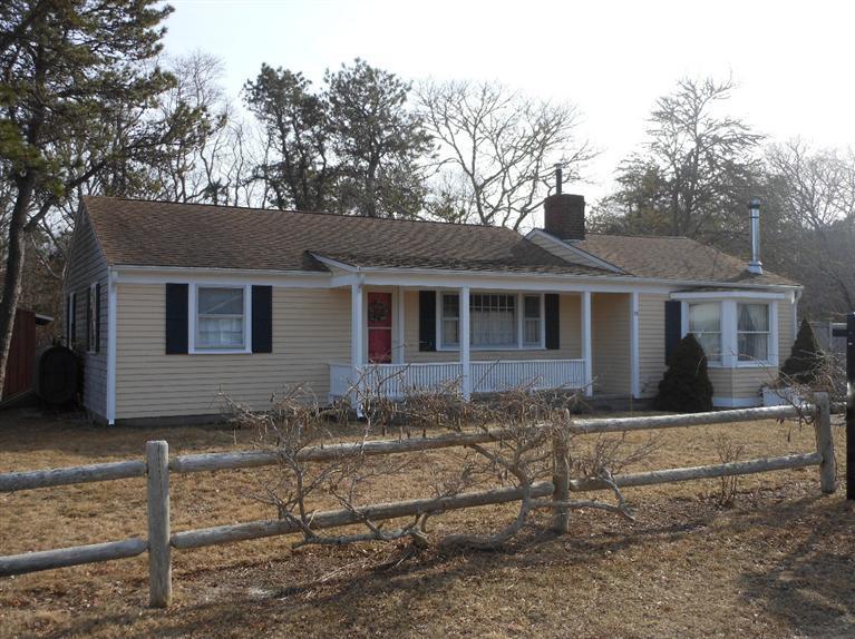 13 Shannon Road Harwich, MA 02645 - Photo 18 of 18 front view of a house with a yard