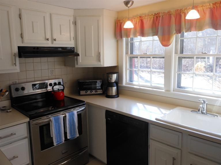 13 Shannon Road Harwich, MA 02645 - Photo 4 of 18 a kitchen with a sink and a window