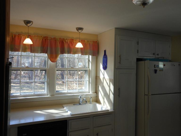 13 Shannon Road Harwich, MA 02645 - Photo 5 of 18 a bathroom with a bathtub and a sink