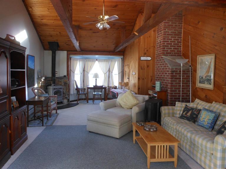 13 Shannon Road Harwich, MA 02645 - Photo 7 of 18 a living room with furniture and a fireplace