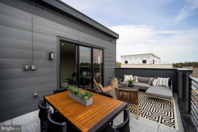 a kitchen with a table and chairs in it