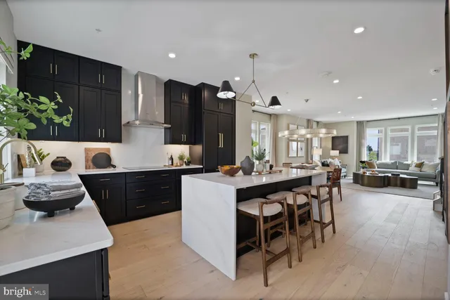 a living room with furniture large window and a fireplace