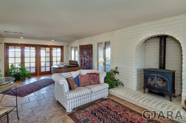 3412 D Road Palisade, CO 81526 - Photo 3 of 9 a living room with furniture and a fireplace