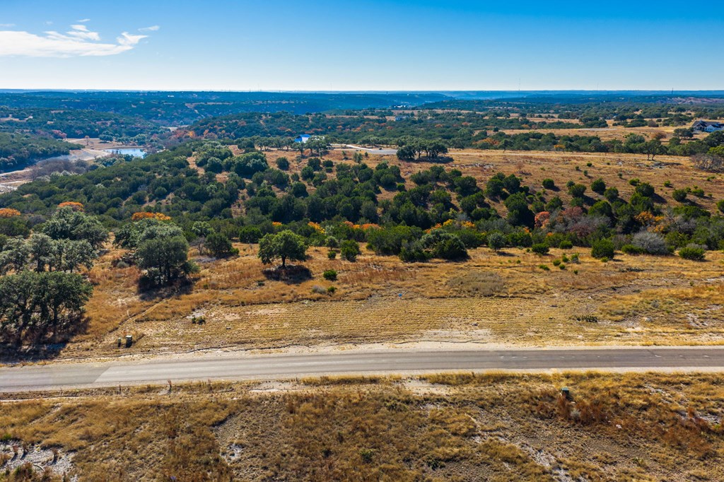 Lot 130 Dillon Rdg Drive Kerrville, TX 78028 - Photo 9 of 11 a view of a large body of water with a large tree