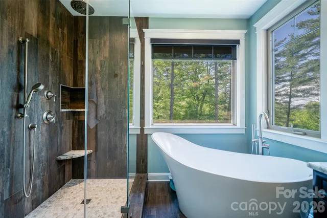 a bathroom with a toilet and a shower