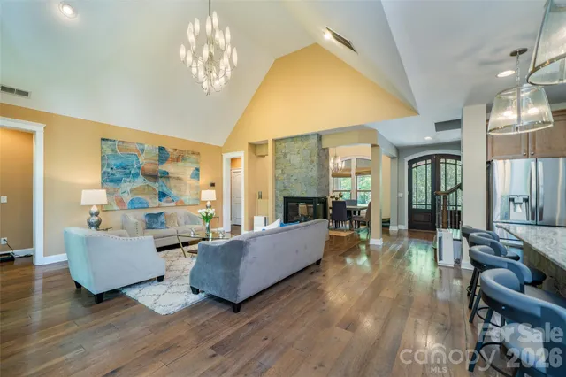 a living room with a large window and a table