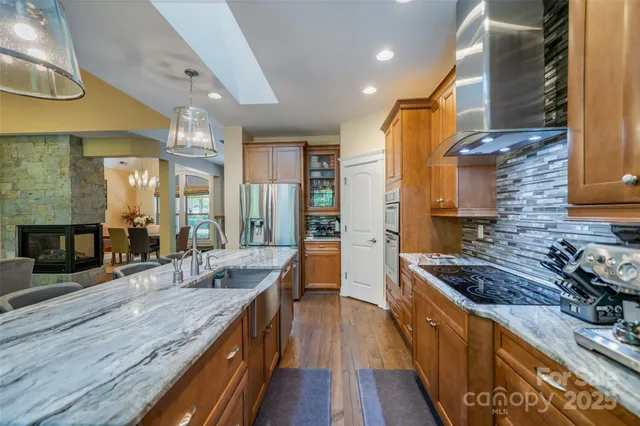 a kitchen with granite countertop a sink and cabinets