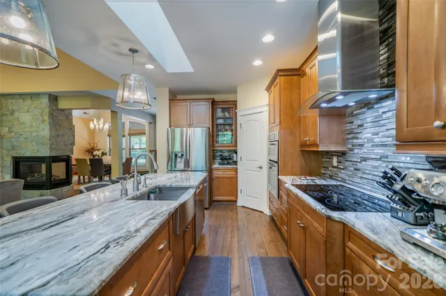 a view of a workspace with furniture and a workspace