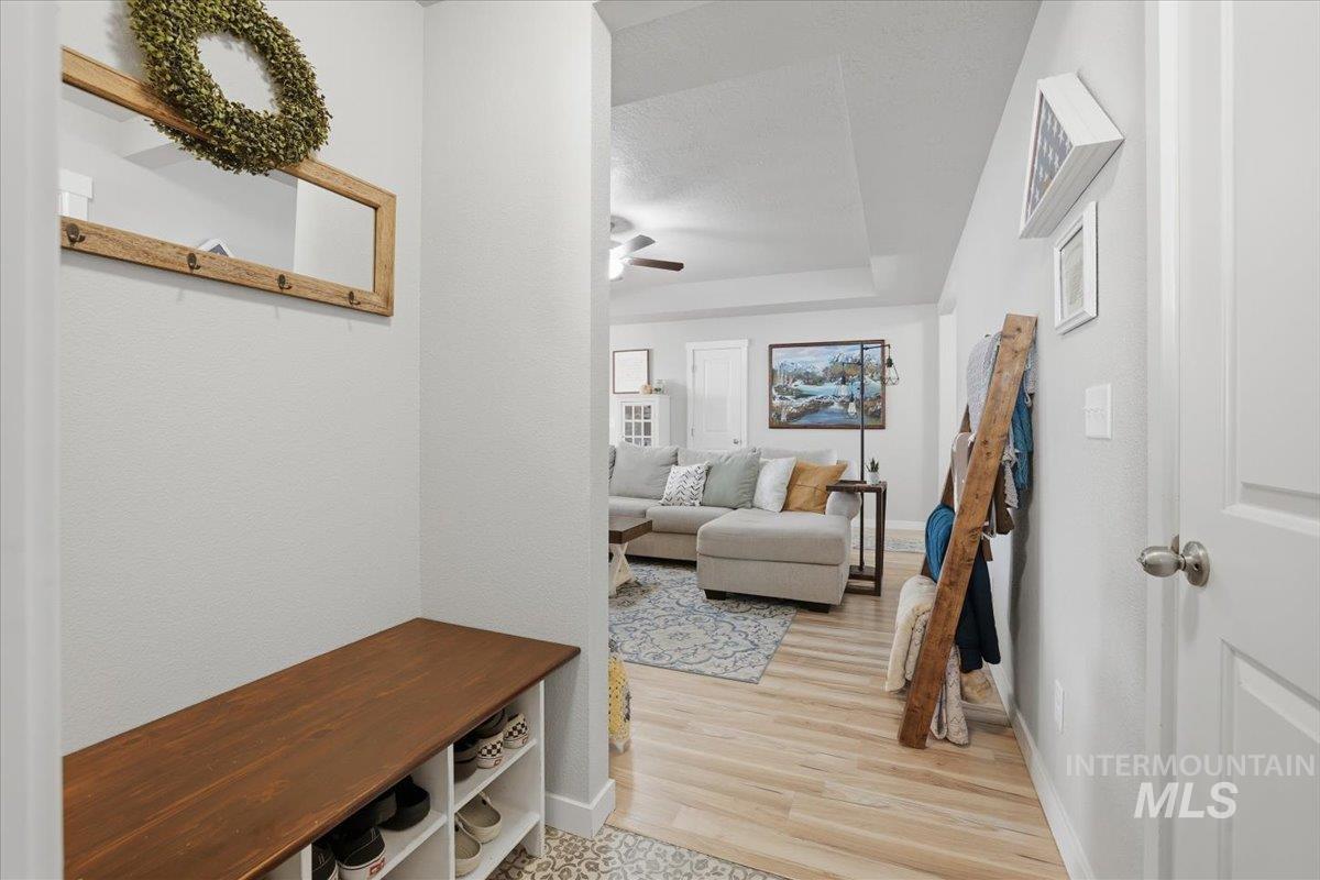 16682 Loggia Avenue Caldwell, ID 83607 - Photo 21 of 46 Mudroom featuring ceiling fan and light wood-type flooring