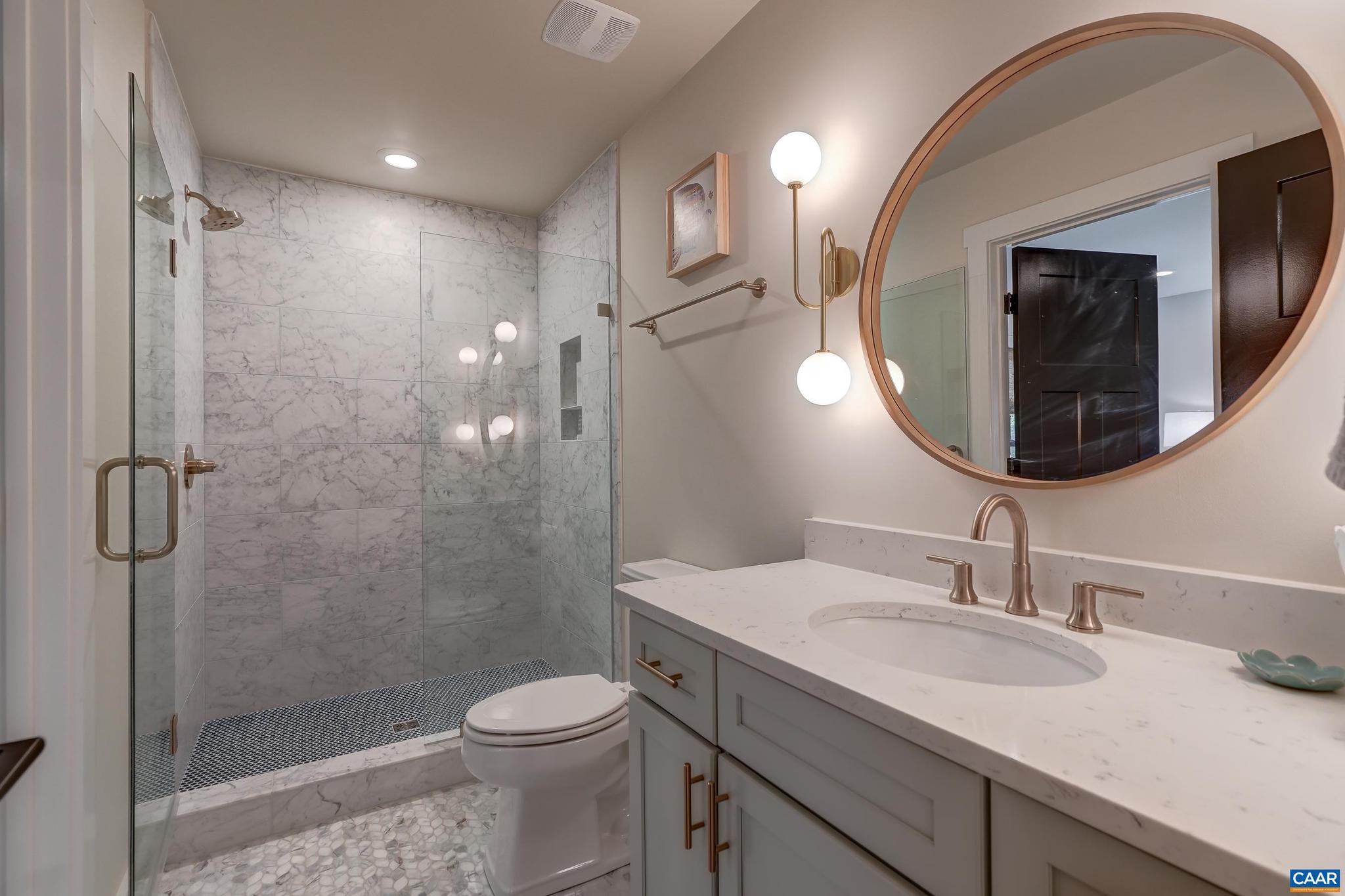 3327 Rowcross Street Crozet, VA 22932 - Photo 41 of 63 a bathroom with a sink toilet and shower