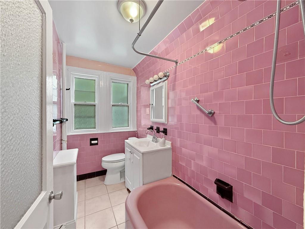 13 Windsor Place Brooklyn, NY 11215 - Photo 11 of 40 a bathroom with a sink a toilet a mirror and shower