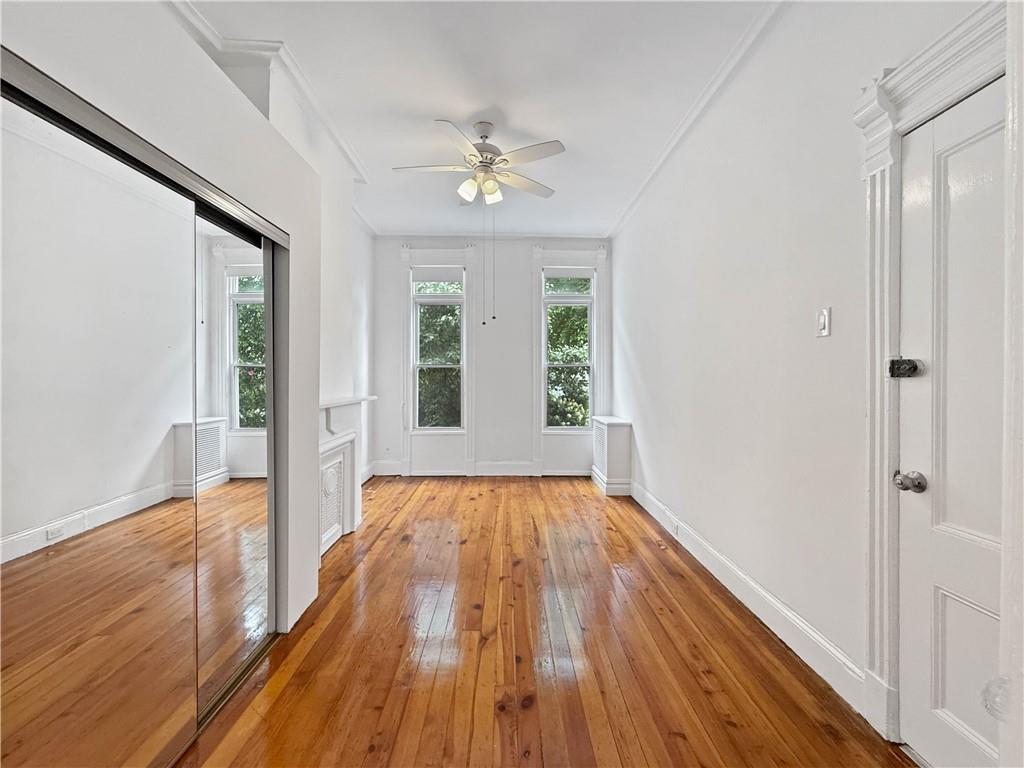 13 Windsor Place Brooklyn, NY 11215 - Photo 17 of 40 wooden floor in an empty room with a window