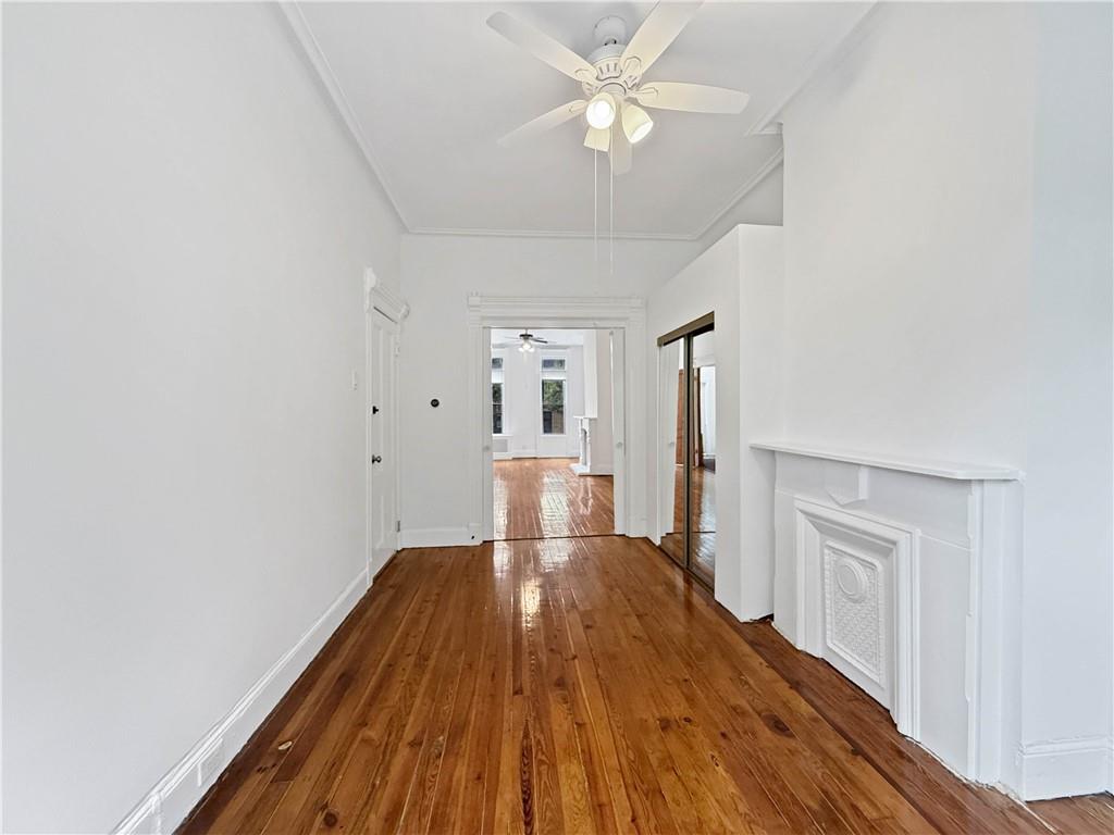 13 Windsor Place Brooklyn, NY 11215 - Photo 18 of 40 a view of a livingroom with wooden floor and a ceiling fan