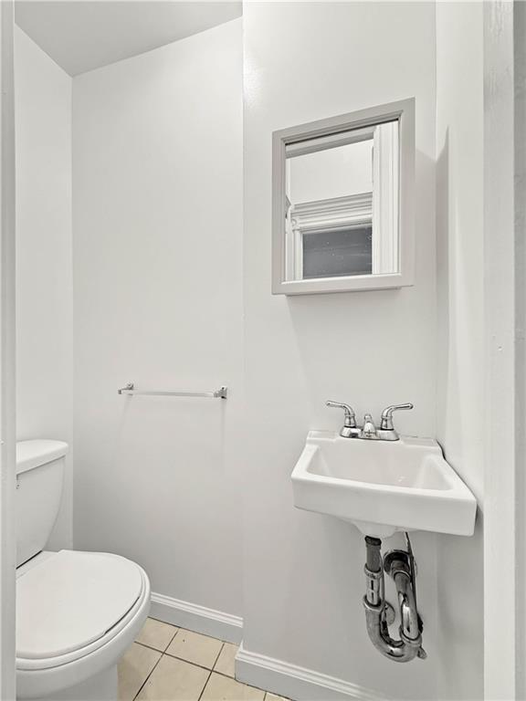 13 Windsor Place Brooklyn, NY 11215 - Photo 20 of 40 a bathroom with a sink a mirror and a toilet