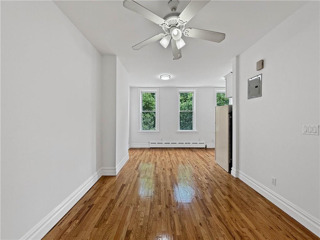 13 Windsor Place Brooklyn, NY 11215 - Photo 25 of 40 wooden floor in an empty room with a window