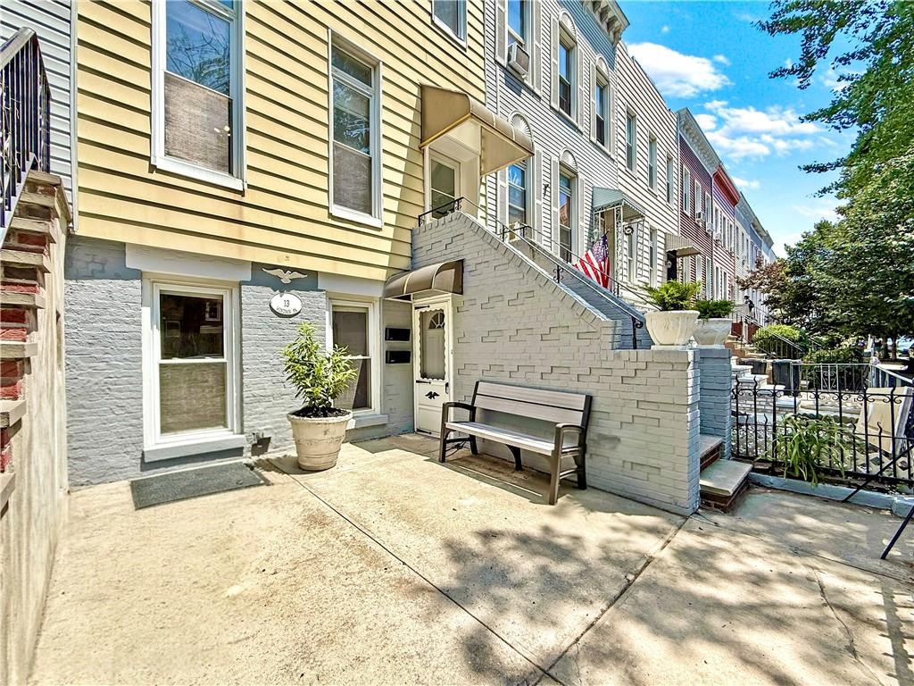 13 Windsor Place Brooklyn, NY 11215 - Photo 3 of 40 a view of a building with a bench in front of house