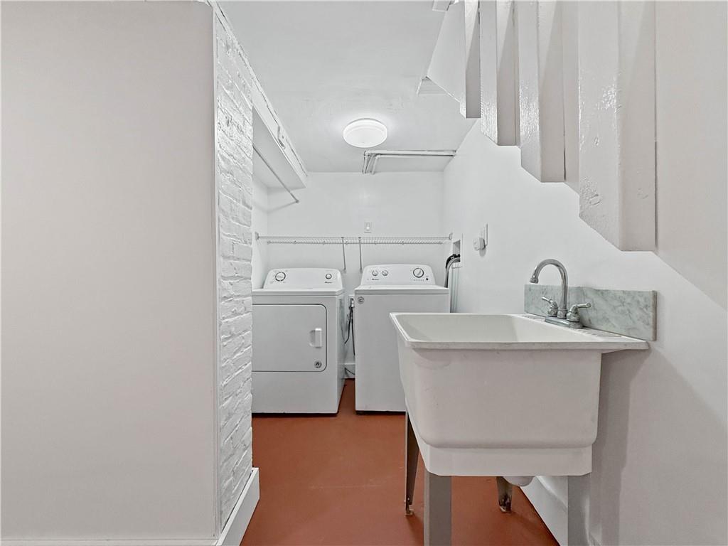 13 Windsor Place Brooklyn, NY 11215 - Photo 31 of 40 a utility room with sink dryer and washer