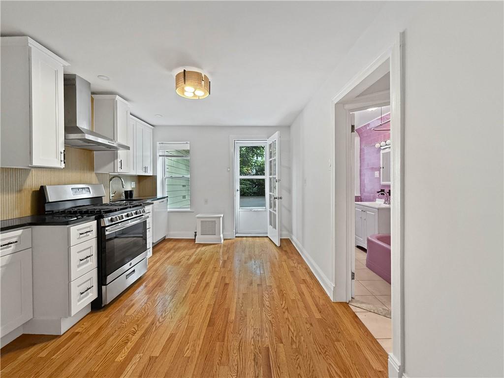 13 Windsor Place Brooklyn, NY 11215 - Photo 8 of 40 a kitchen with stainless steel appliances a stove a sink and a refrigerator