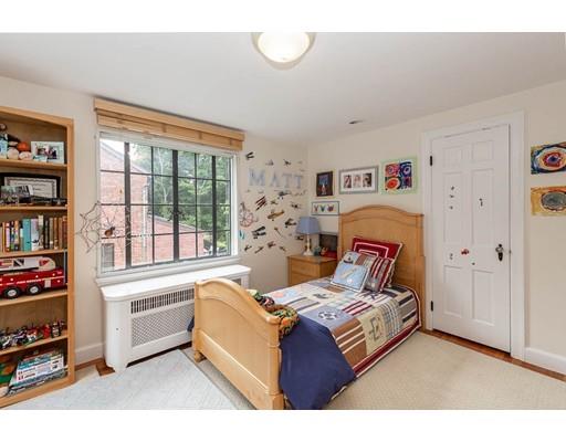 29 Sunset Road Newton, MA 02458 - Photo 24 of 38 a living room with furniture and a book shelf