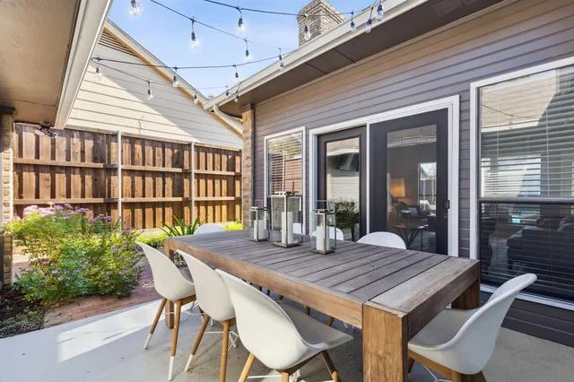 a outdoor space with a table and chairs