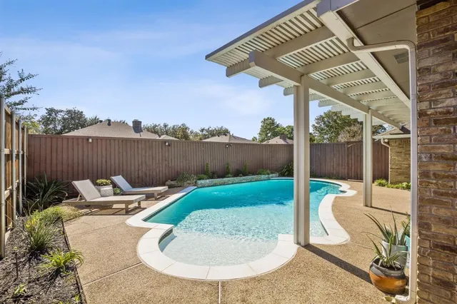 an outdoor sitting area with furniture