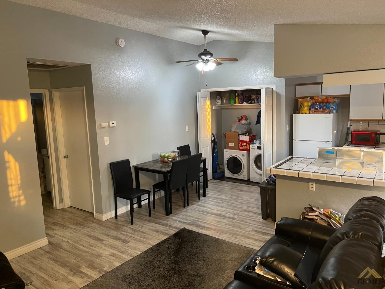 Undisclosed Address Bakersfield, CA 93309 - Photo 3 of 11 a view of a dining room with furniture and chandelier