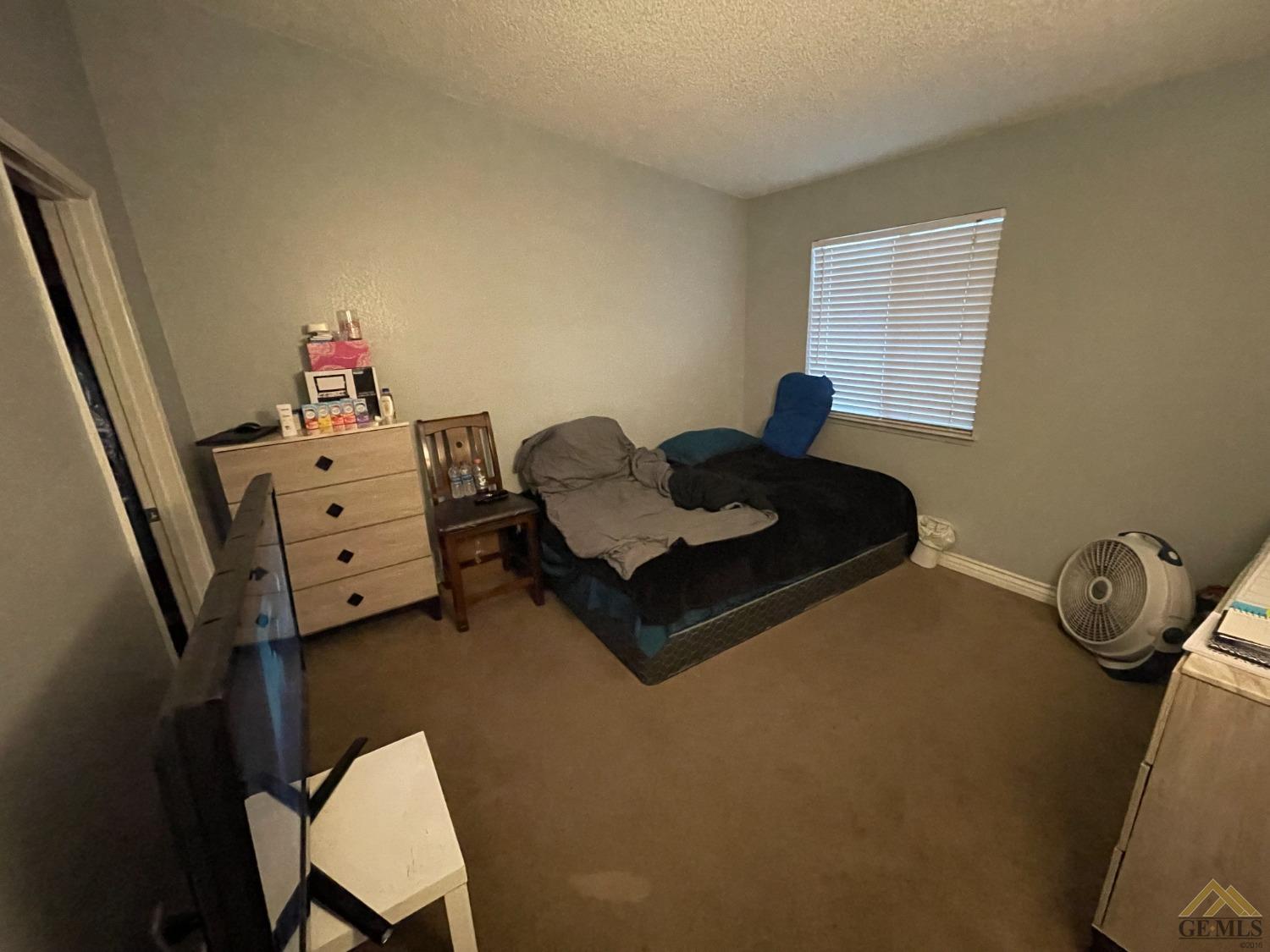 Undisclosed Address Bakersfield, CA 93309 - Photo 6 of 11 a living room with furniture and a wooden floor
