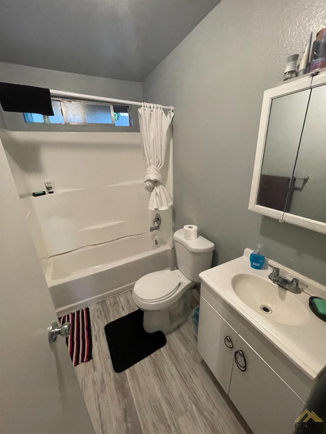 Undisclosed Address Bakersfield, CA 93309 - Photo 9 of 11 a bathroom with a sink toilet and mirror