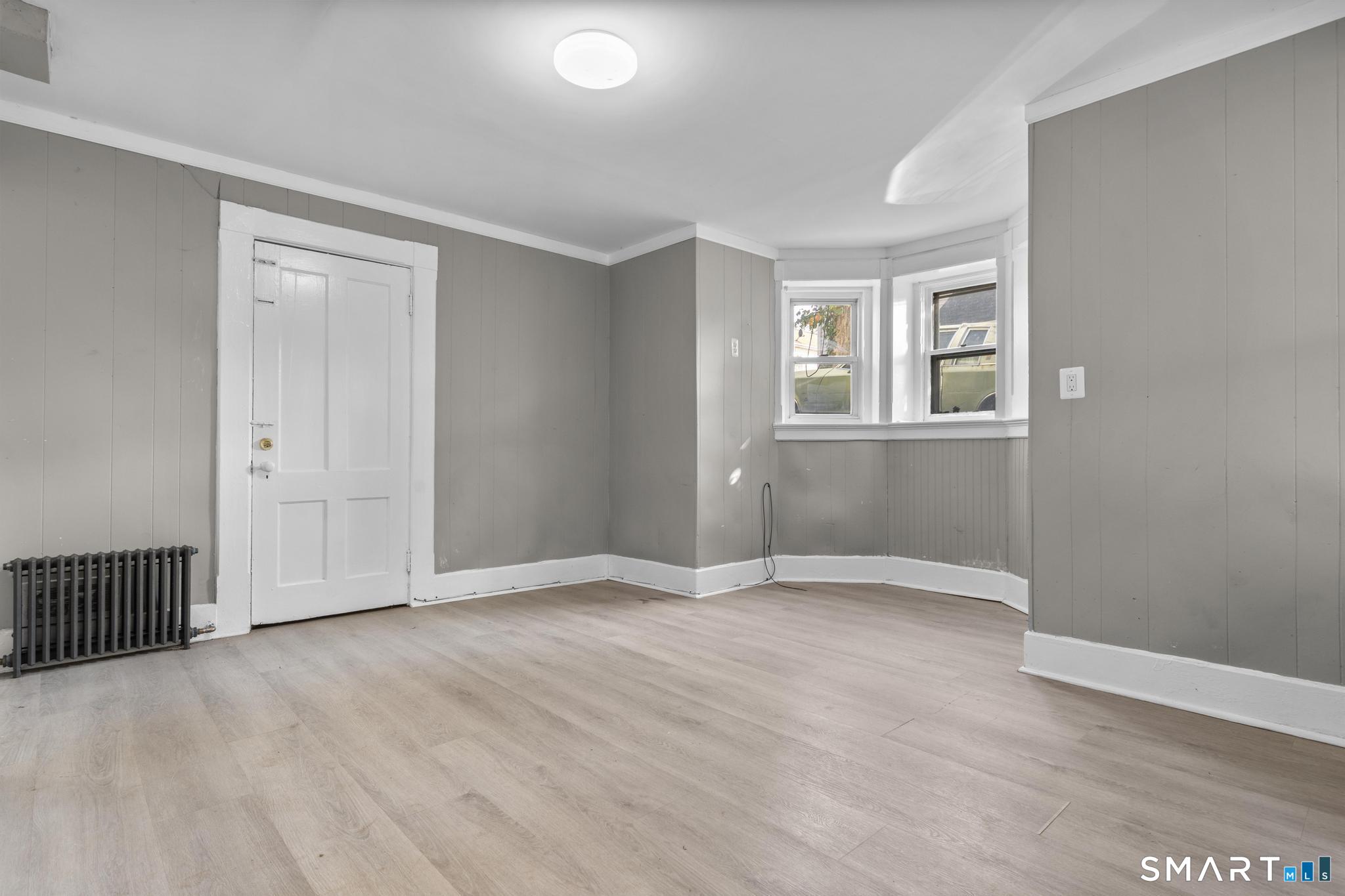 18 Hobart Street Meriden, CT 06450 - Photo 14 of 16 an empty room with windows