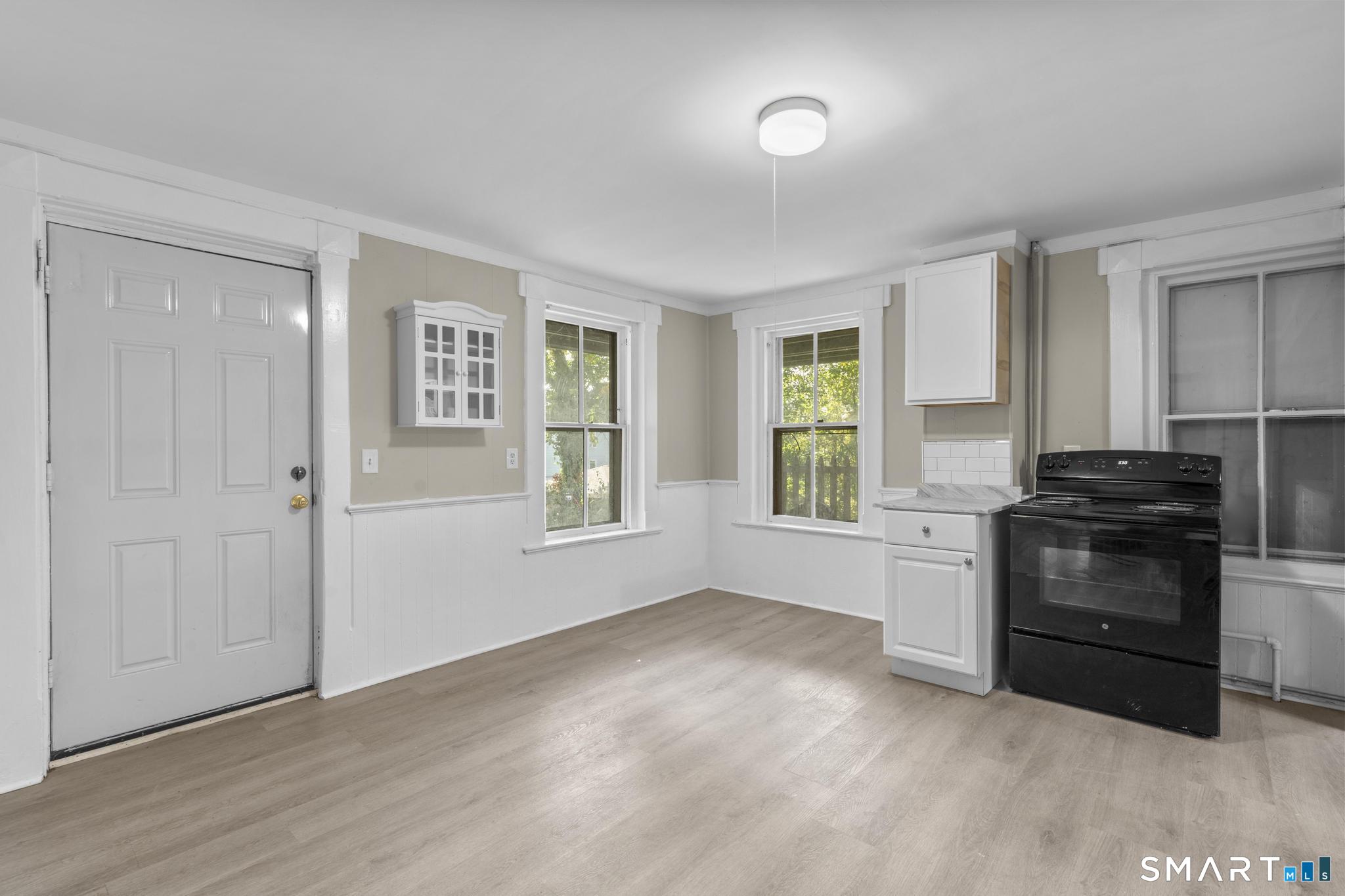 18 Hobart Street Meriden, CT 06450 - Photo 7 of 16 a kitchen with a stove and a window