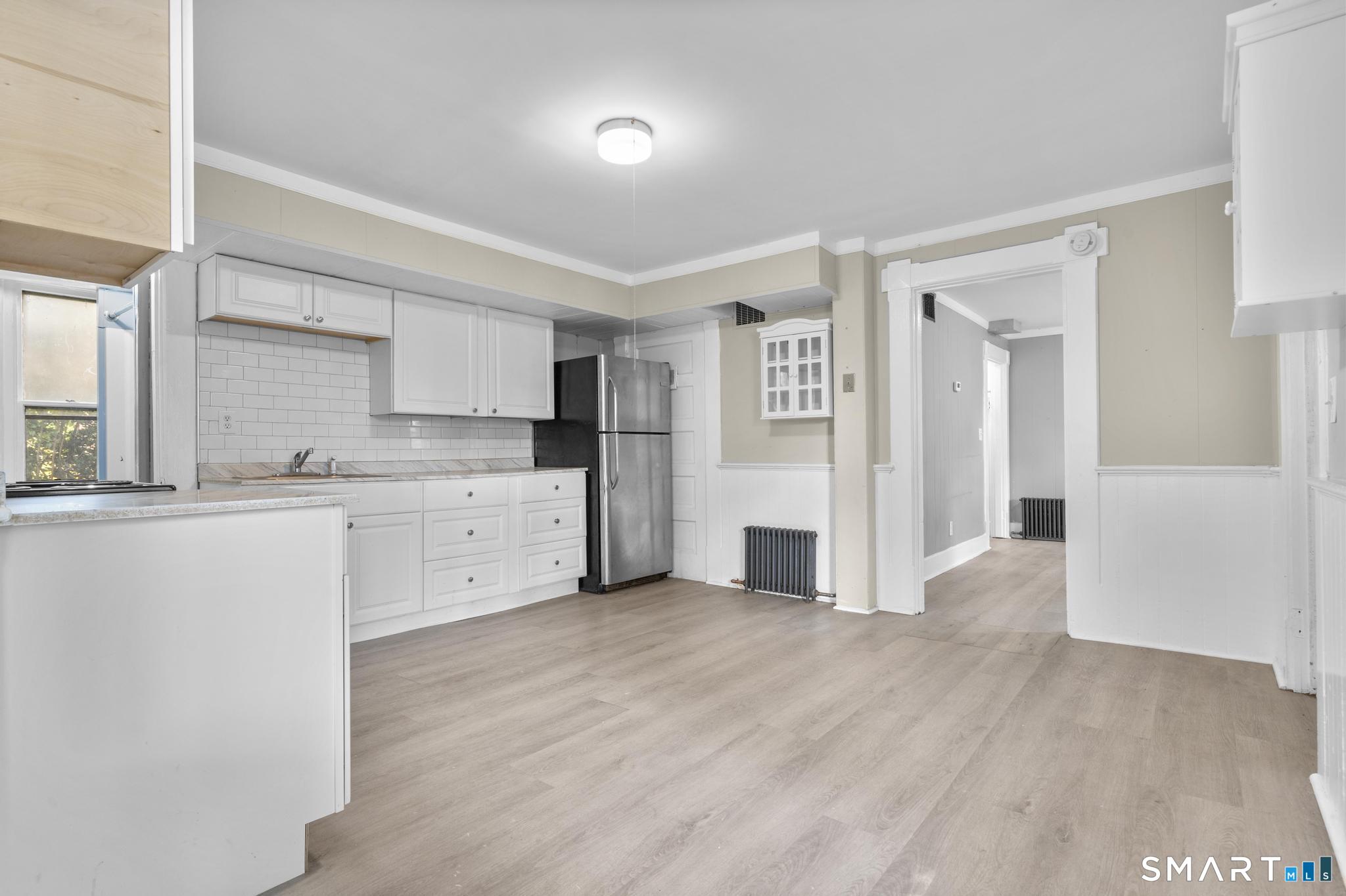18 Hobart Street Meriden, CT 06450 - Photo 10 of 16 a view of a kitchen with wooden floor