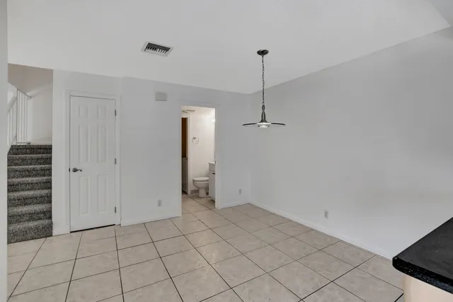 a view of an empty room and closet area
