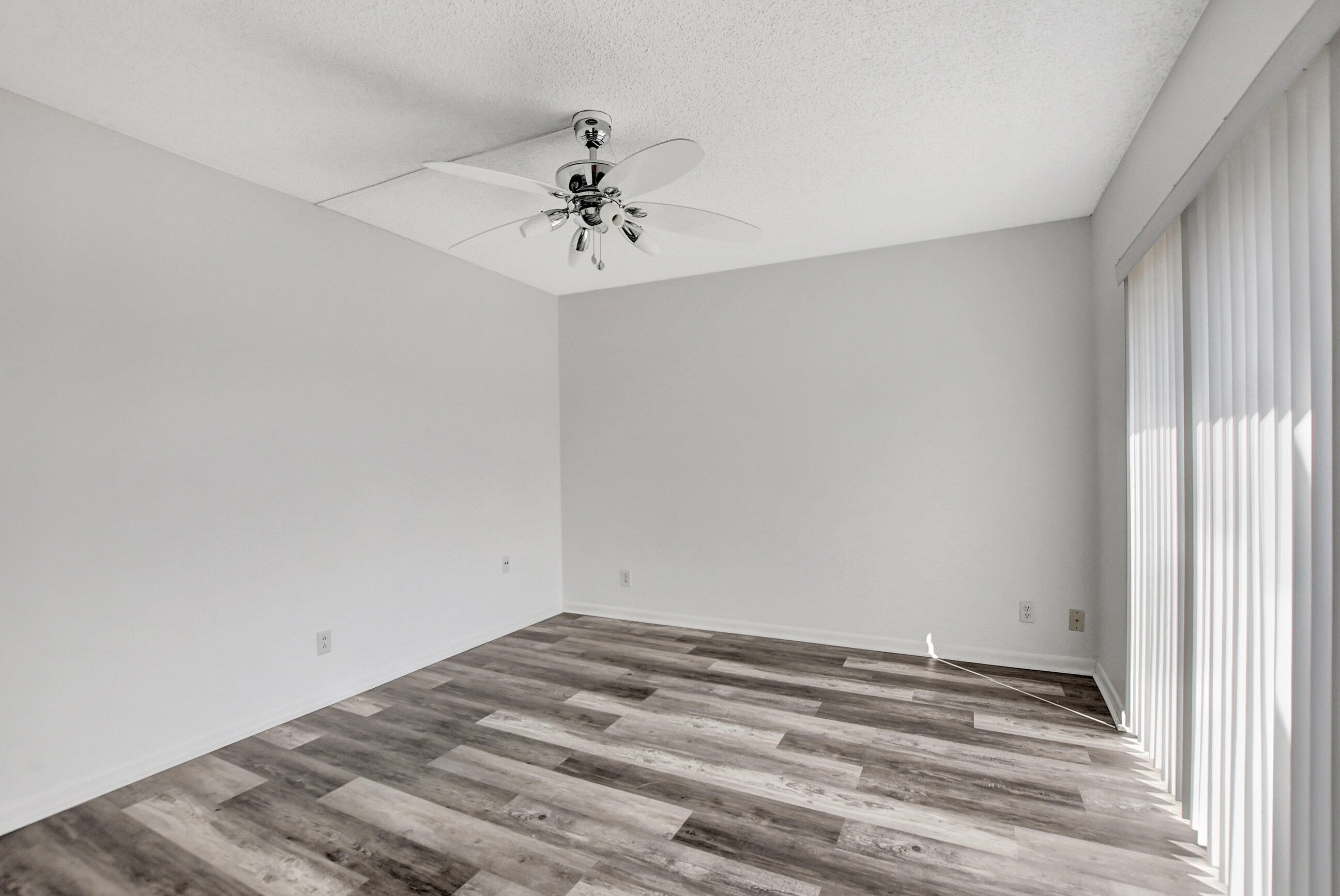 2555 Albatross Road North, Unit 2A Delray Beach, FL 33444 - Photo 25 of 27 a view of a room with a ceiling fan