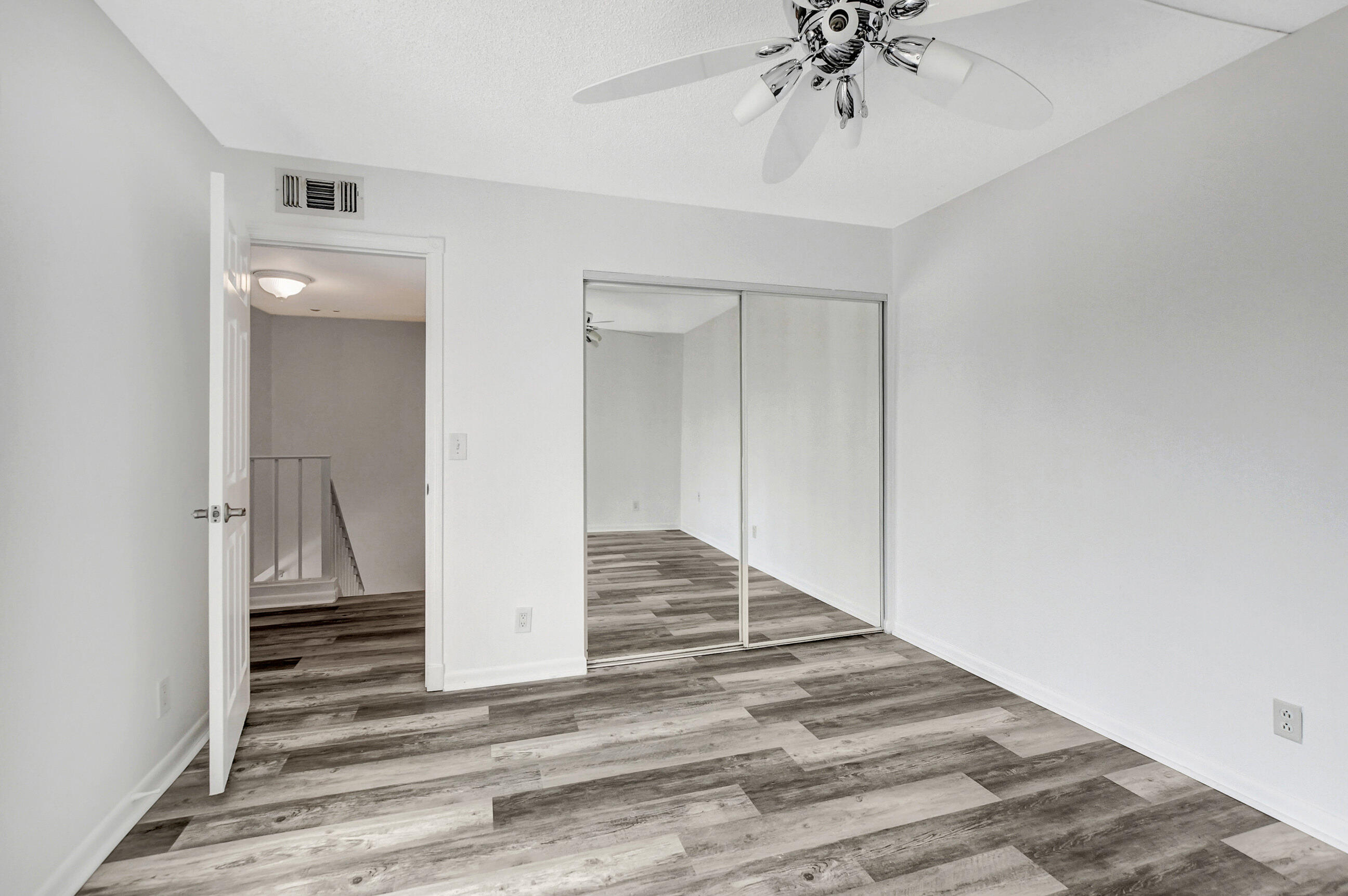 2555 Albatross Road North, Unit 2A Delray Beach, FL 33444 - Photo 26 of 27 a view of a hallway view with staircase