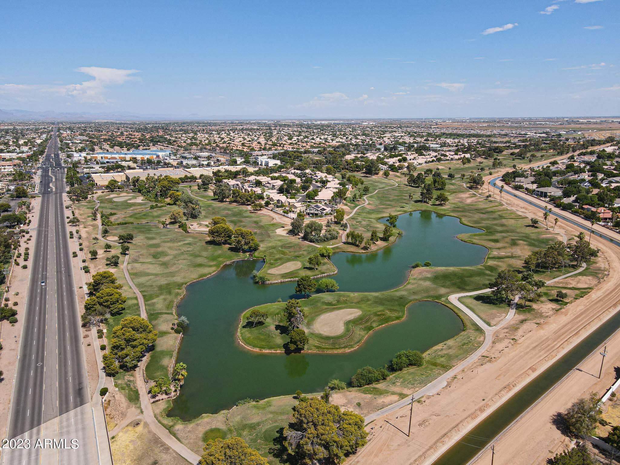 6060 East Baseline Road, Unit 170 Mesa, AZ 85206 - Photo 41 of 45 an aerial view of a house with a lake view