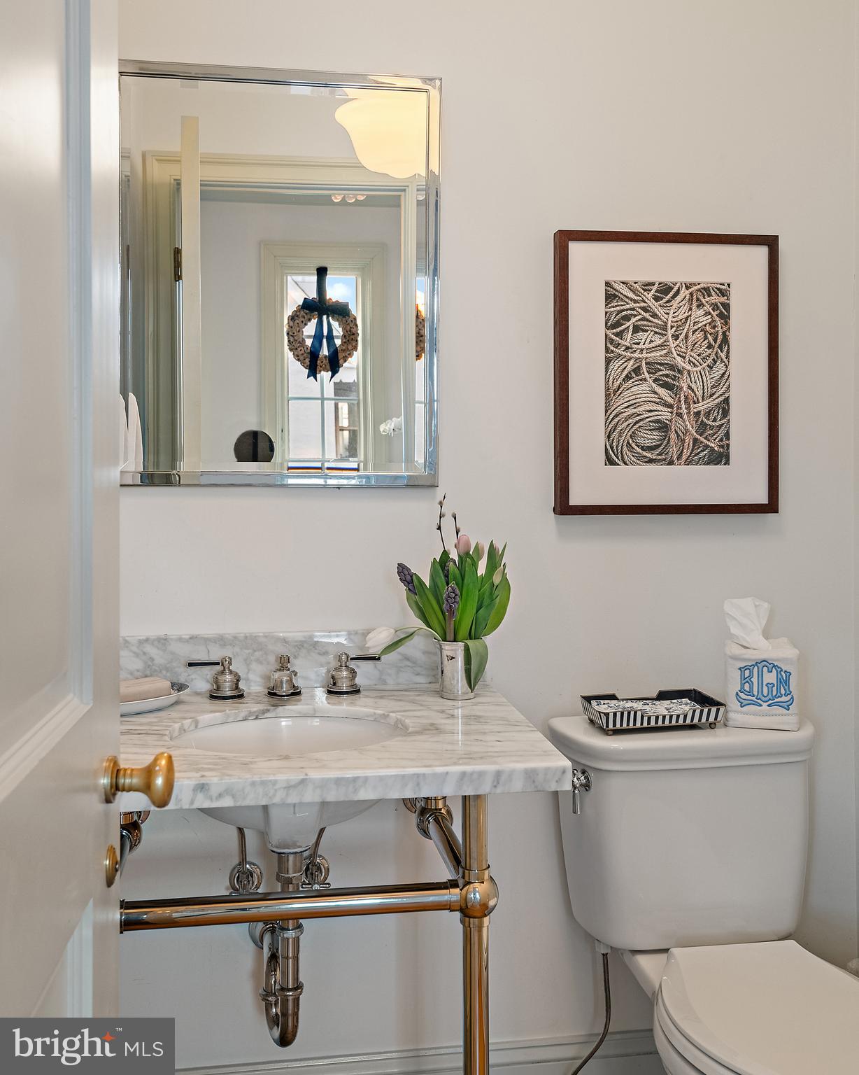313 Washington Street Annapolis, MD 21403 - Photo 44 of 114 a bathroom with a toilet a sink and mirror
