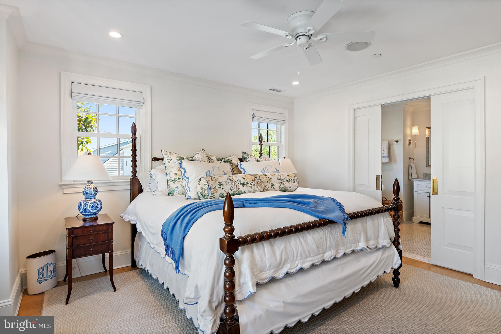 313 Washington Street Annapolis, MD 21403 - Photo 48 of 114 a bedroom with bed and a chandelier