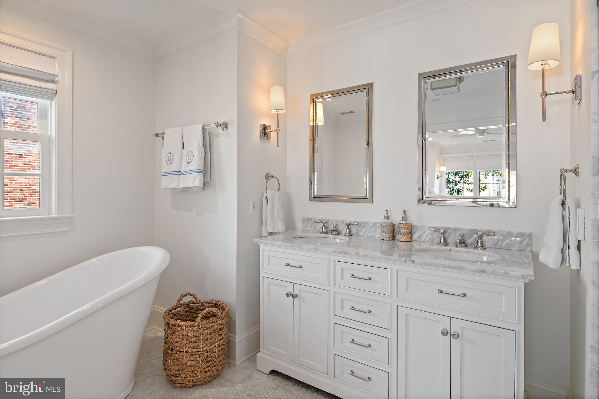313 Washington Street Annapolis, MD 21403 - Photo 50 of 114 a spacious bathroom with a granite countertop tub sink and mirror