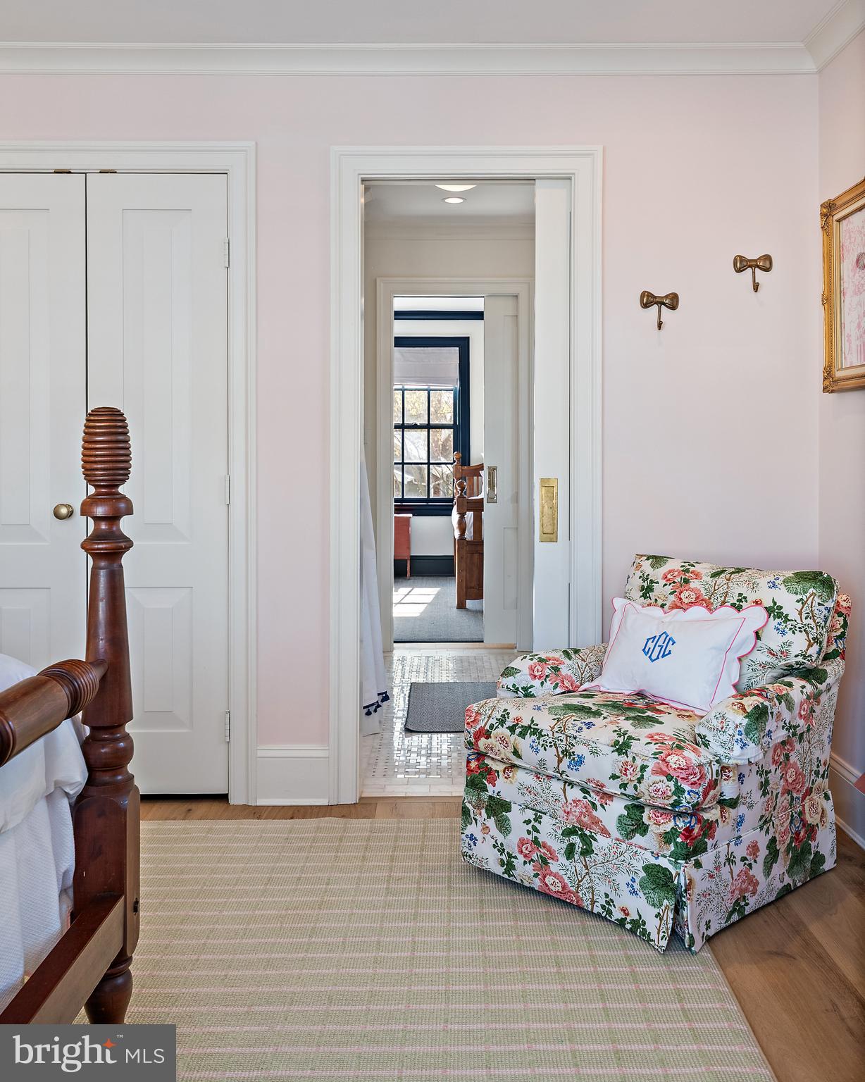 313 Washington Street Annapolis, MD 21403 - Photo 56 of 114 a bedroom with a bed and a chandelier