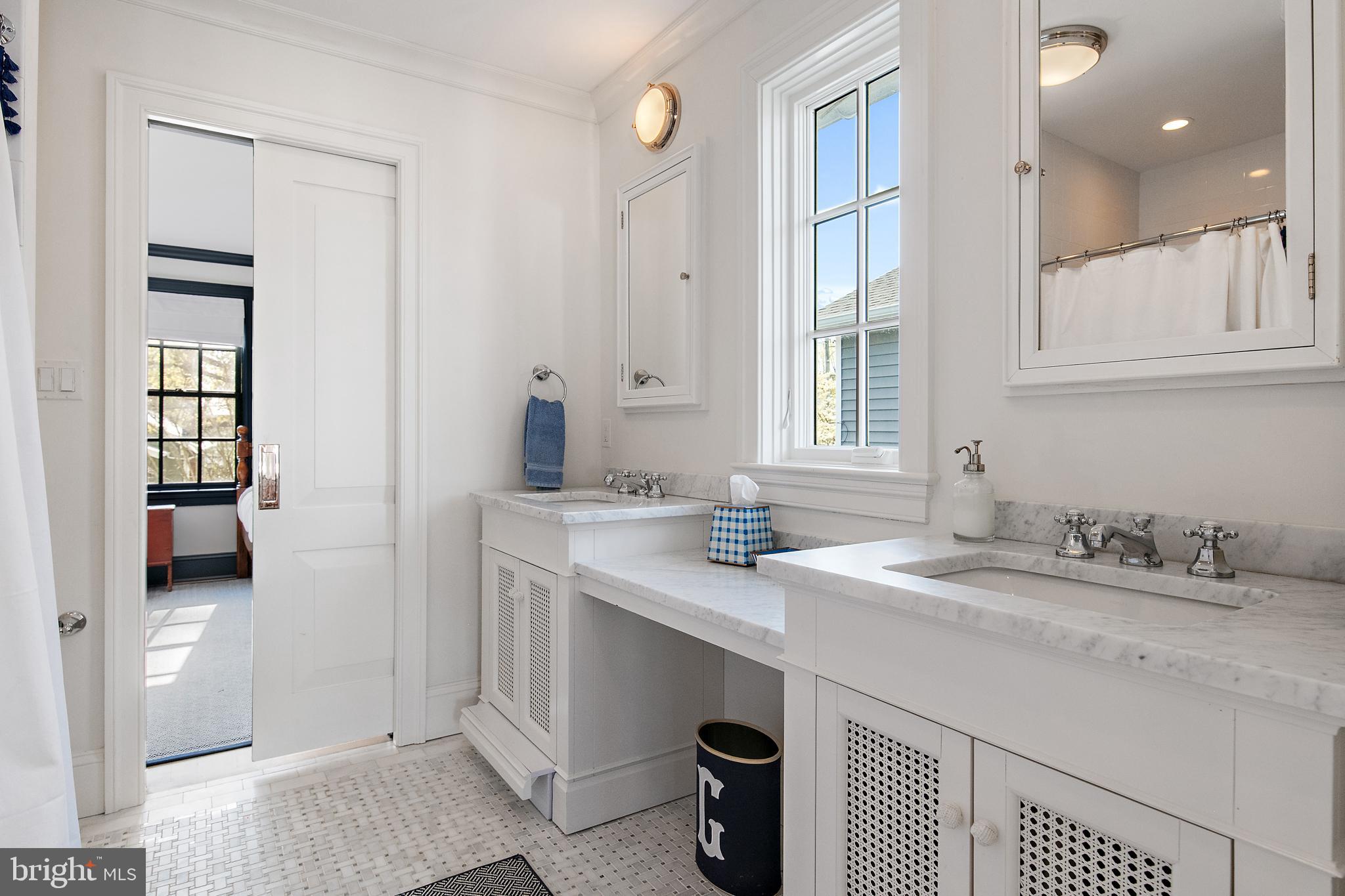 313 Washington Street Annapolis, MD 21403 - Photo 57 of 114 a bathroom with a sink double vanity and a shower