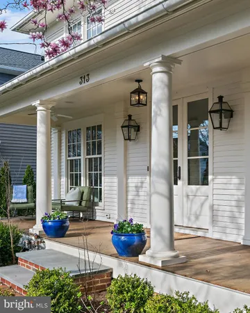 a view of a house with a yard and sitting area