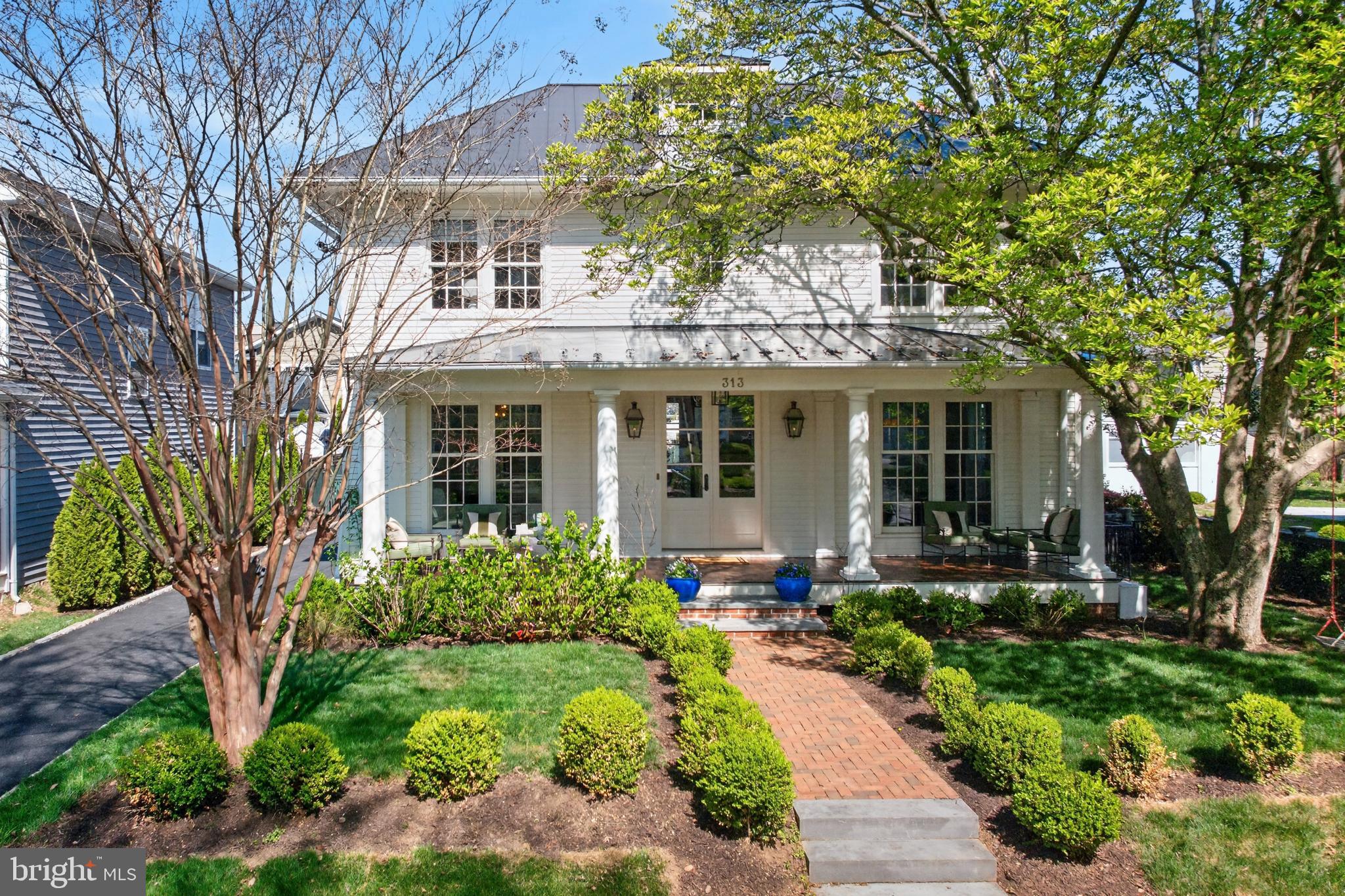 313 Washington Street Annapolis, MD 21403 - Photo 99 of 114 a front view of a house with a yard and potted plants