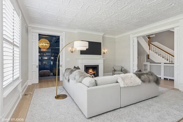 a living room with furniture and a fireplace