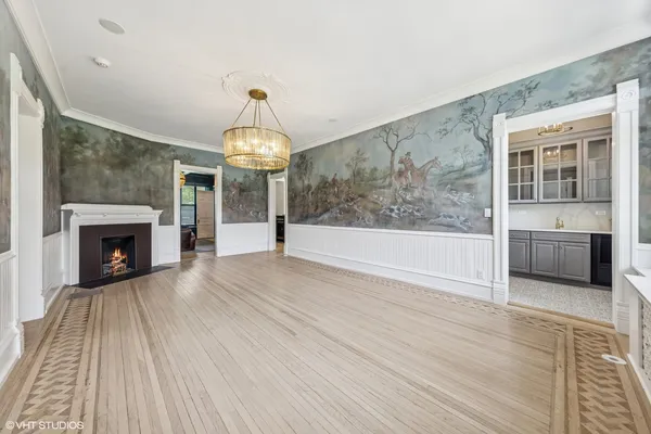a view of livingroom kitchen and hall with wooden floor