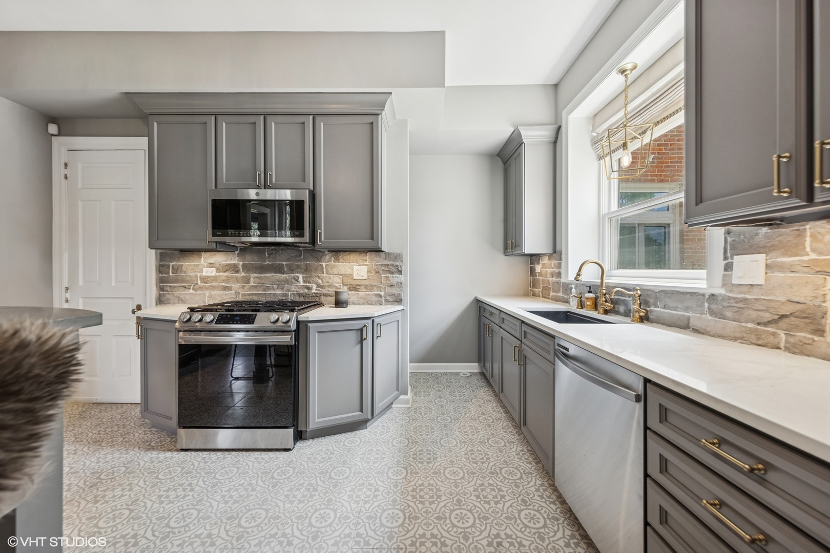 31W141 Army Trail Road Wayne, IL 60184 - Photo 24 of 51 a kitchen with stainless steel appliances a stove sink and microwave