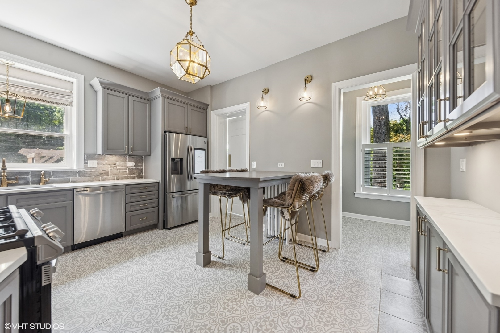 31W141 Army Trail Road Wayne, IL 60184 - Photo 25 of 51 a dining hall with stainless steel appliances kitchen island granite countertop a table chairs and a large window