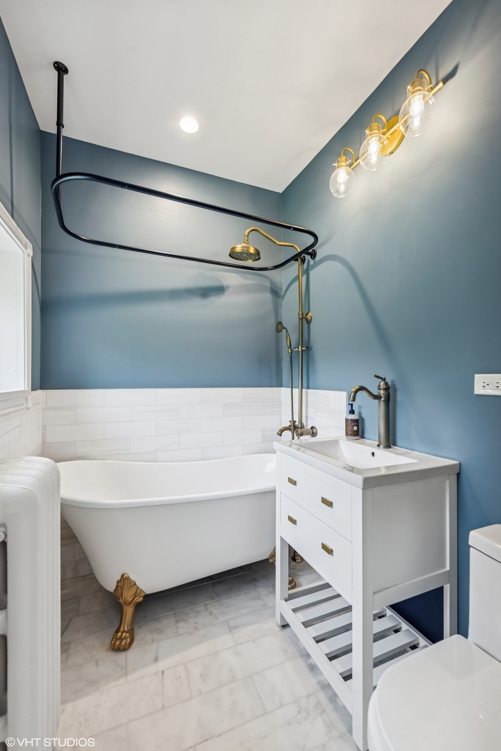 31W141 Army Trail Road Wayne, IL 60184 - Photo 35 of 51 a spacious bathroom with a sink and a mirror