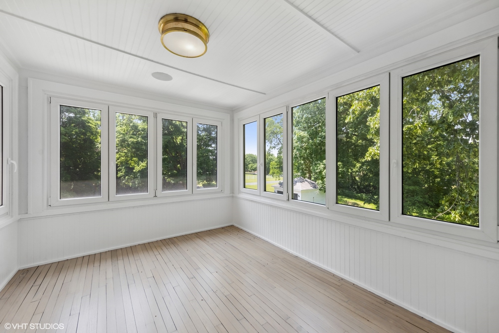 31W141 Army Trail Road Wayne, IL 60184 - Photo 38 of 51 a view of an empty room with wooden floor and a window