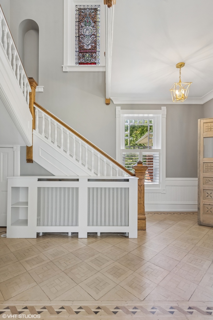 31W141 Army Trail Road Wayne, IL 60184 - Photo 8 of 51 a view of staircase with white walls and a window