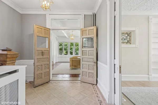 a view of kitchen with furniture and windows